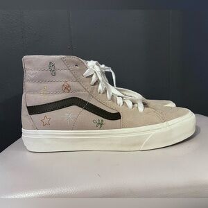 High top van with embroidered designs on sides.